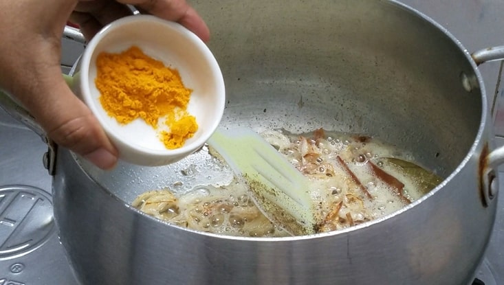 add tumeric powder