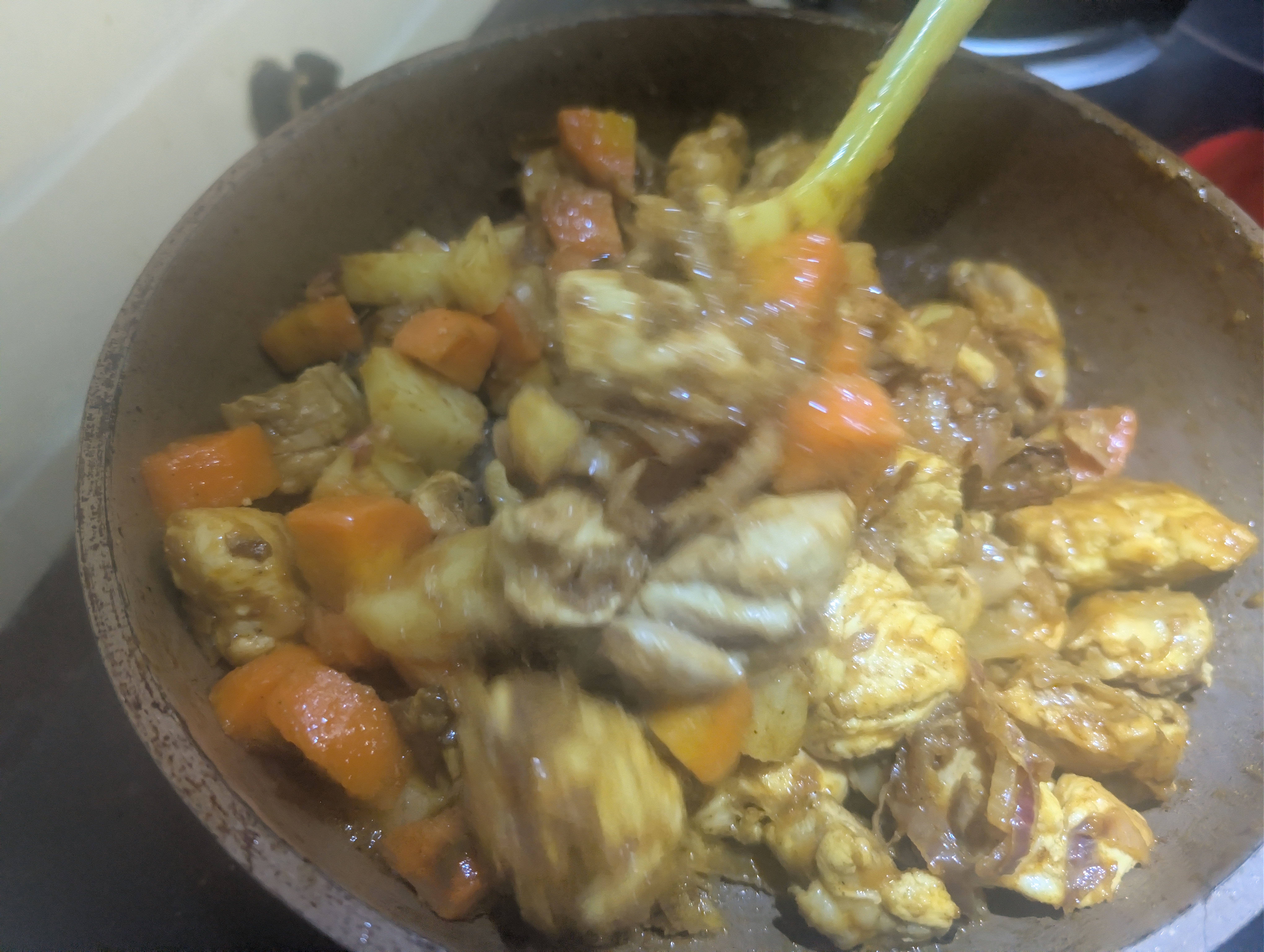 Adding boiled vegetables with chicken
